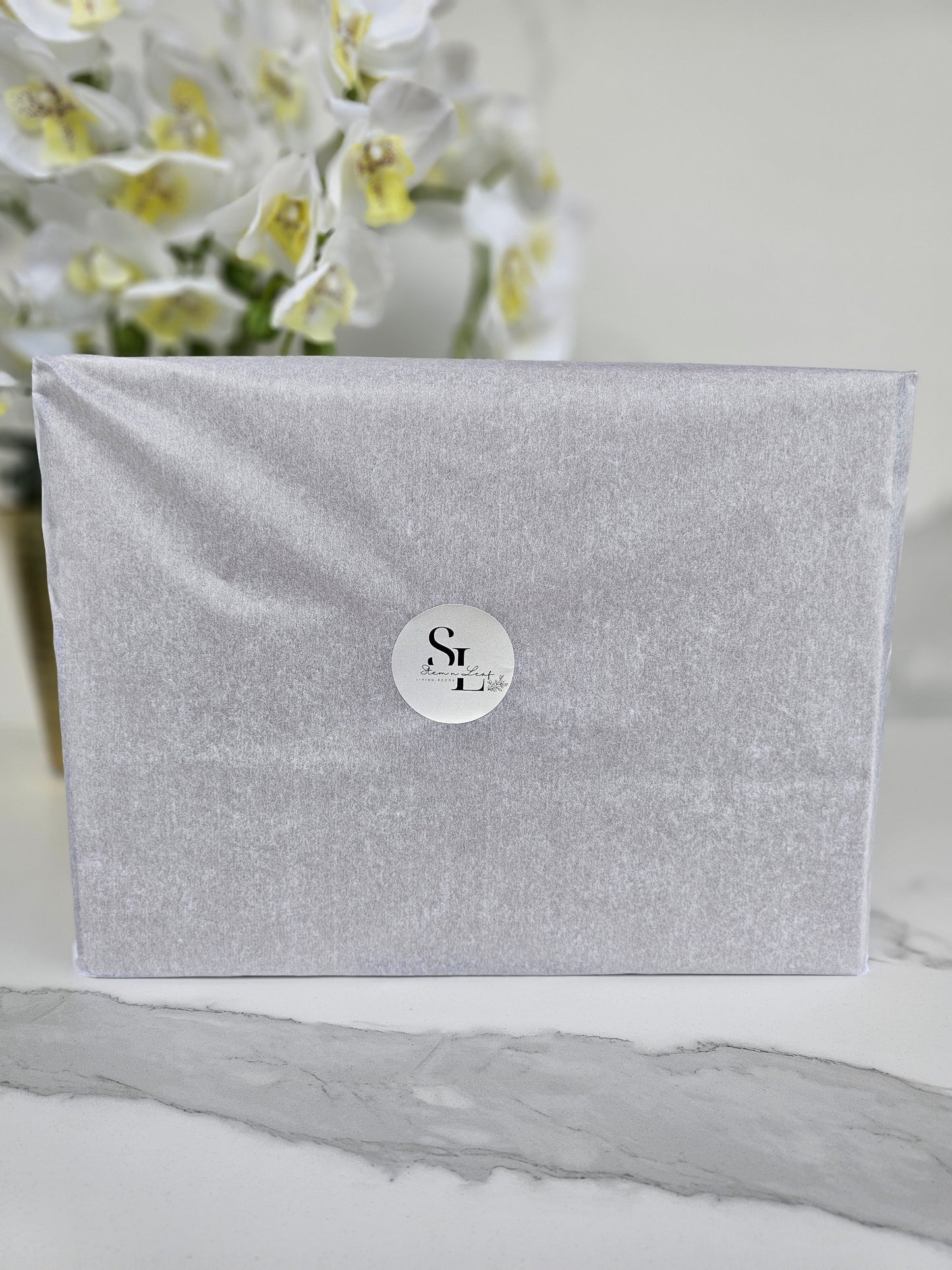 Sleek modern box with a round label on a white background