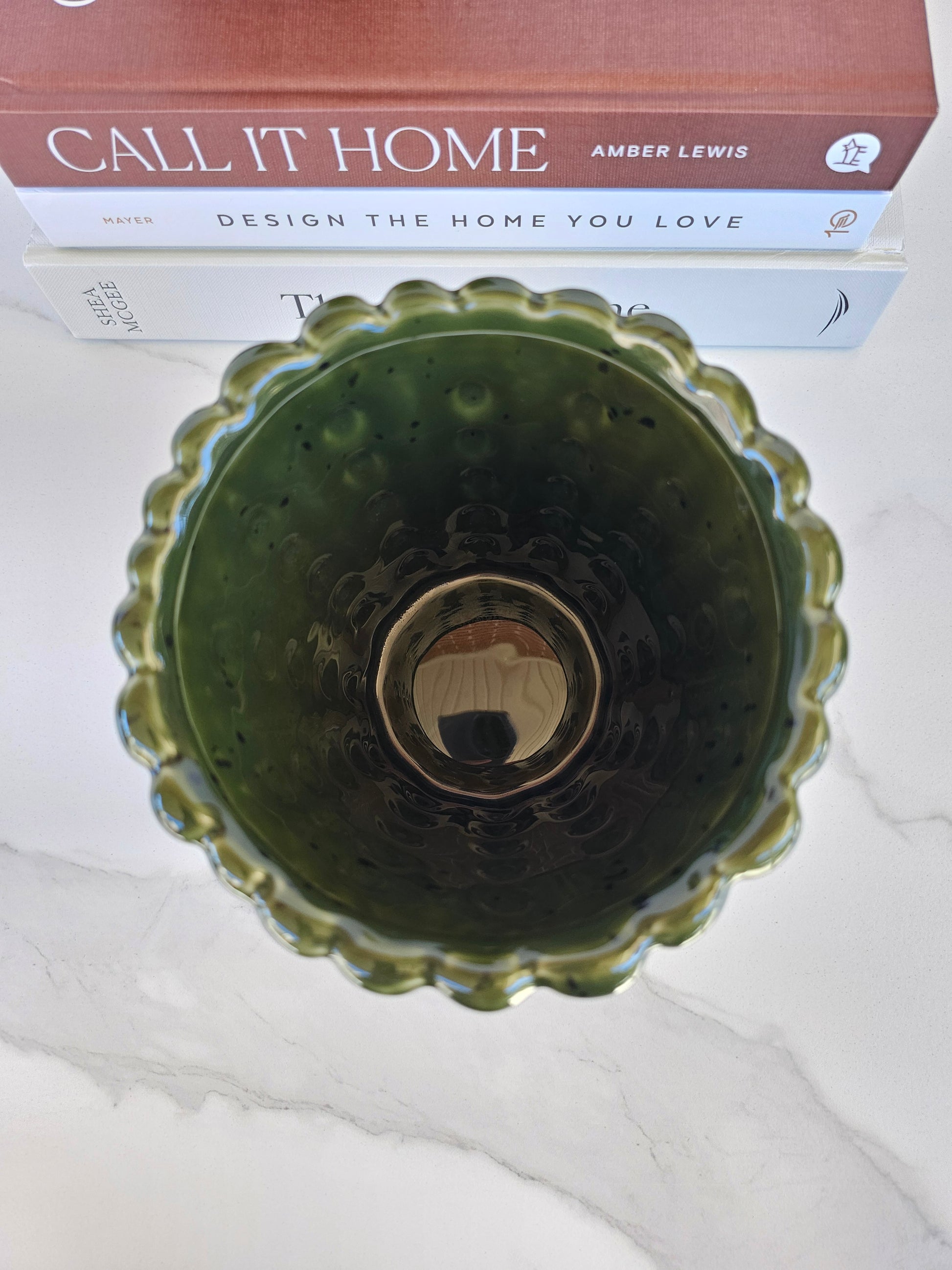 Top view of a deep green ceramic planter showing the wide opening and glossy glaze.