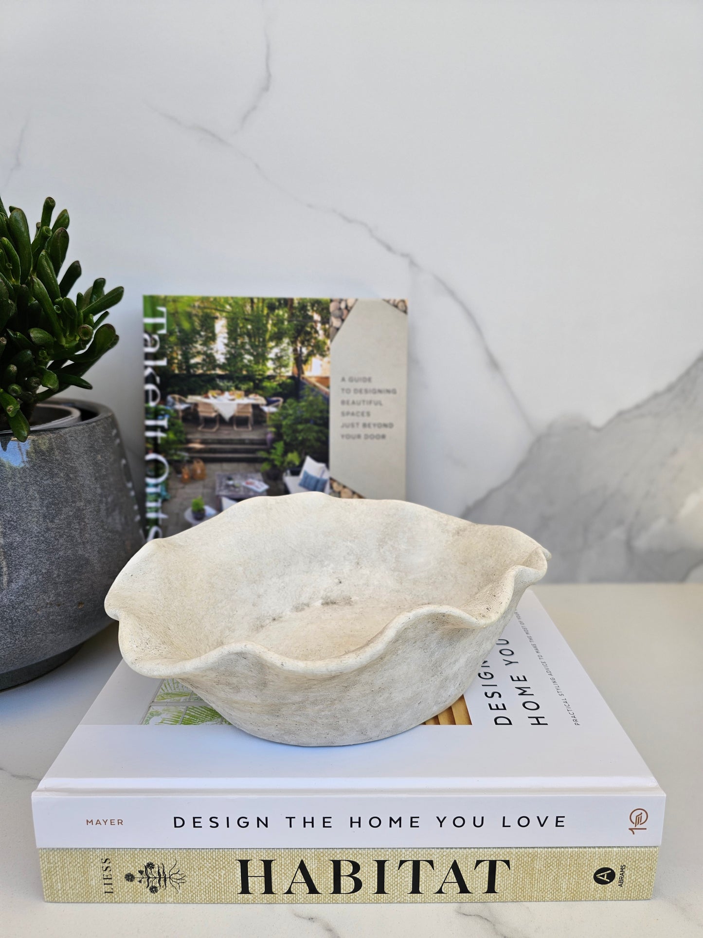 Organic decorative bowl with natural stone look styled as a sculptural centrepiece in a calm neutral home