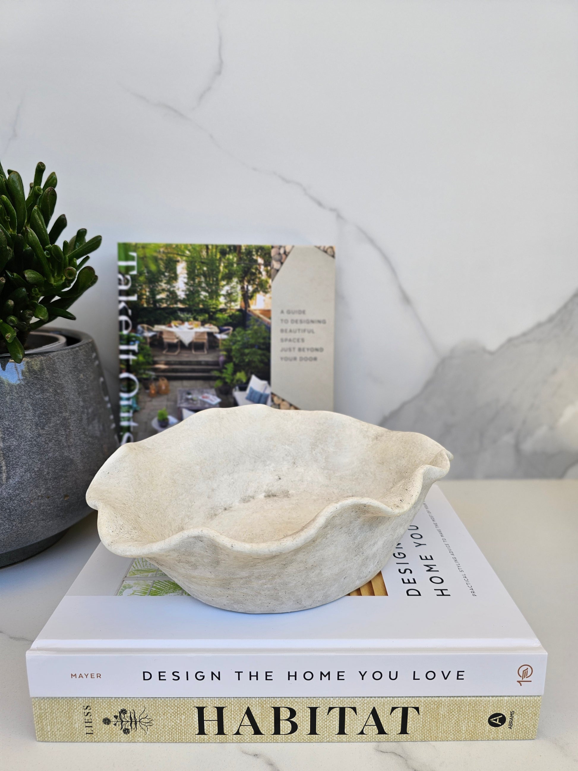 Organic decorative bowl with natural stone look styled as a sculptural centrepiece in a calm neutral home